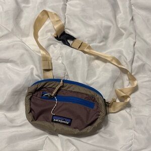 Patagonia Brown Bag with Blue Zippers and Tan Strap
